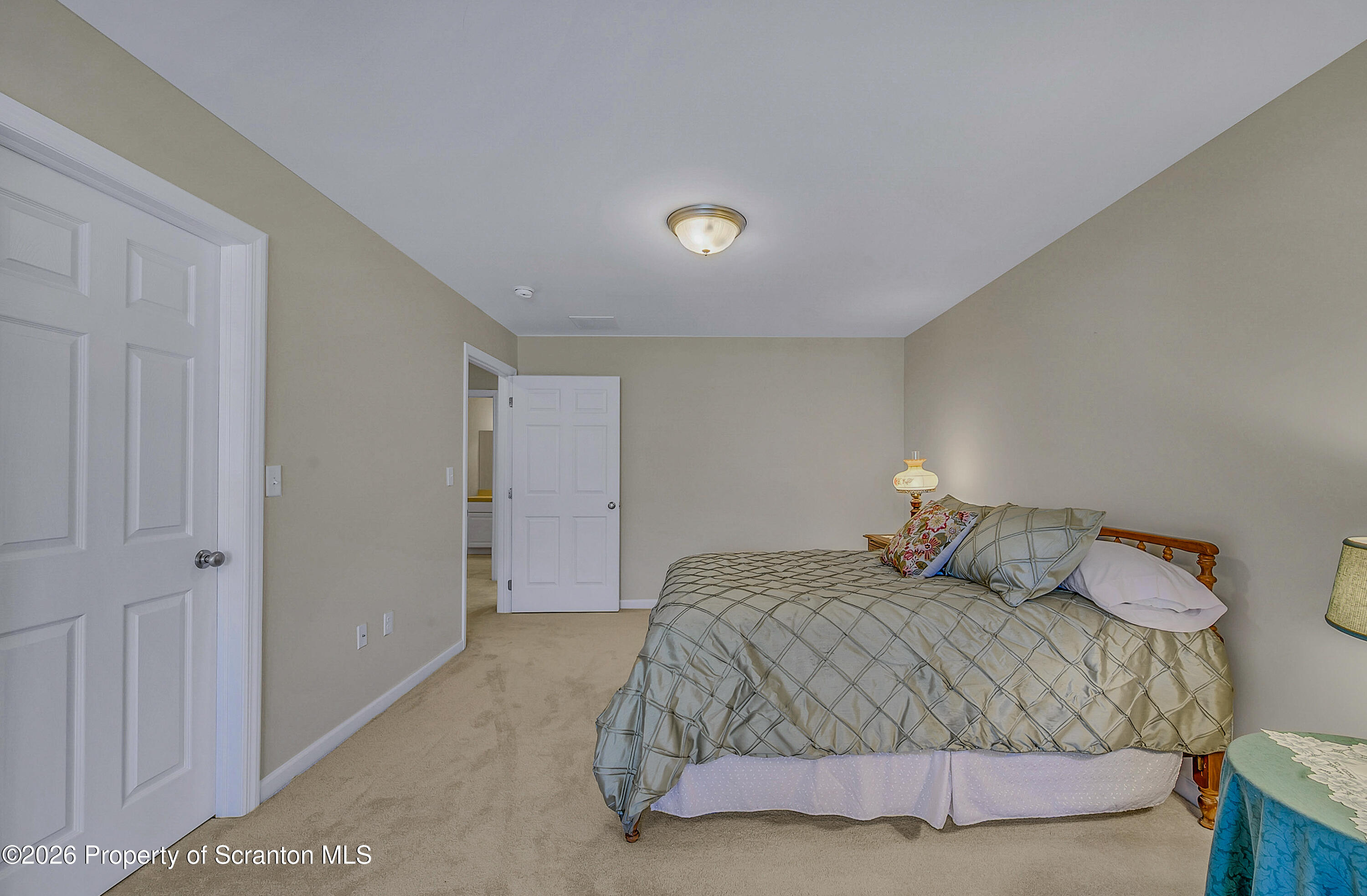 42 Wyndham Road Clarks Summit, PA 18411 - Photo 22 of 36 a bedroom with a bed and a night stand
