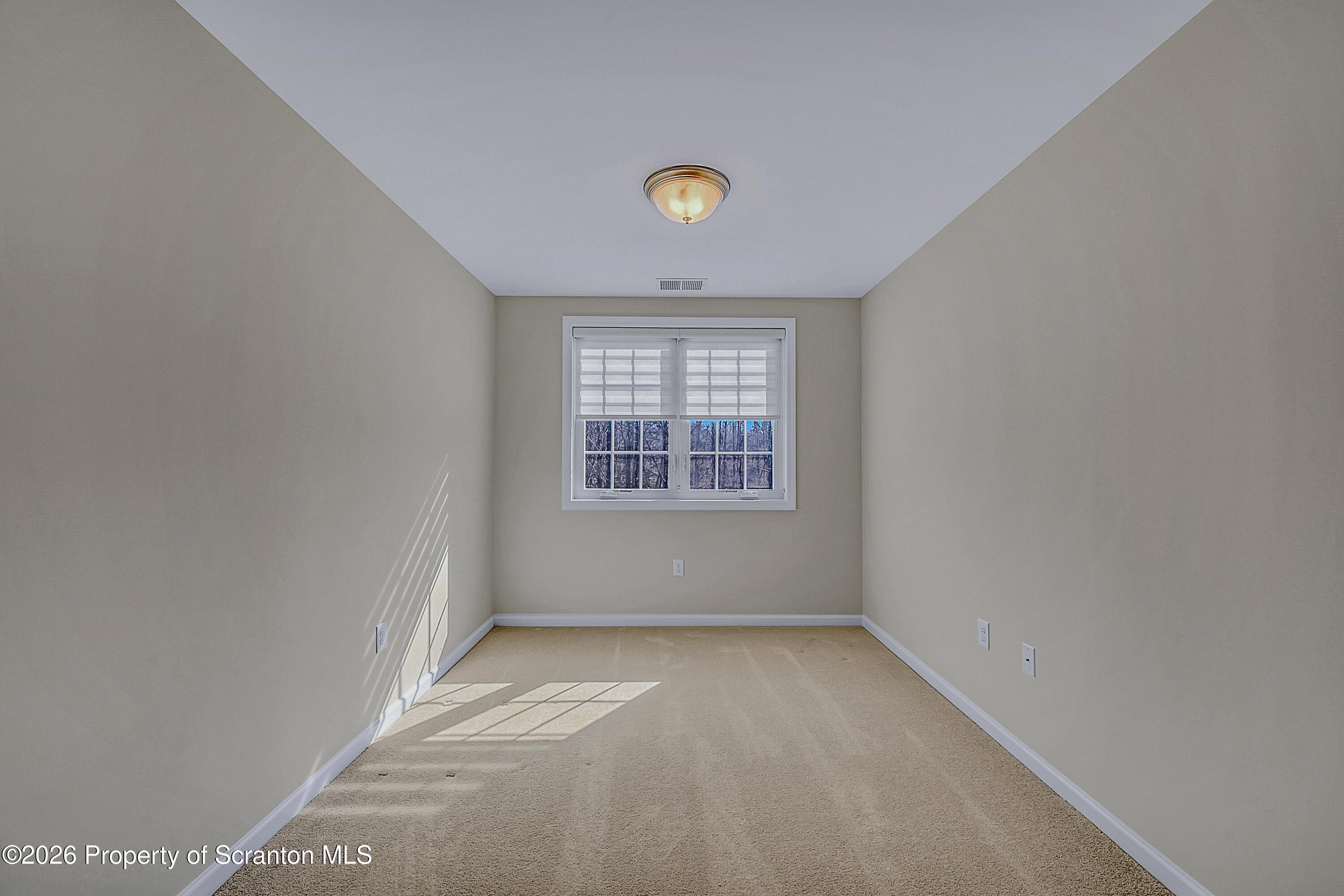 42 Wyndham Road Clarks Summit, PA 18411 - Photo 26 of 36 a view of room with window and ceiling fan