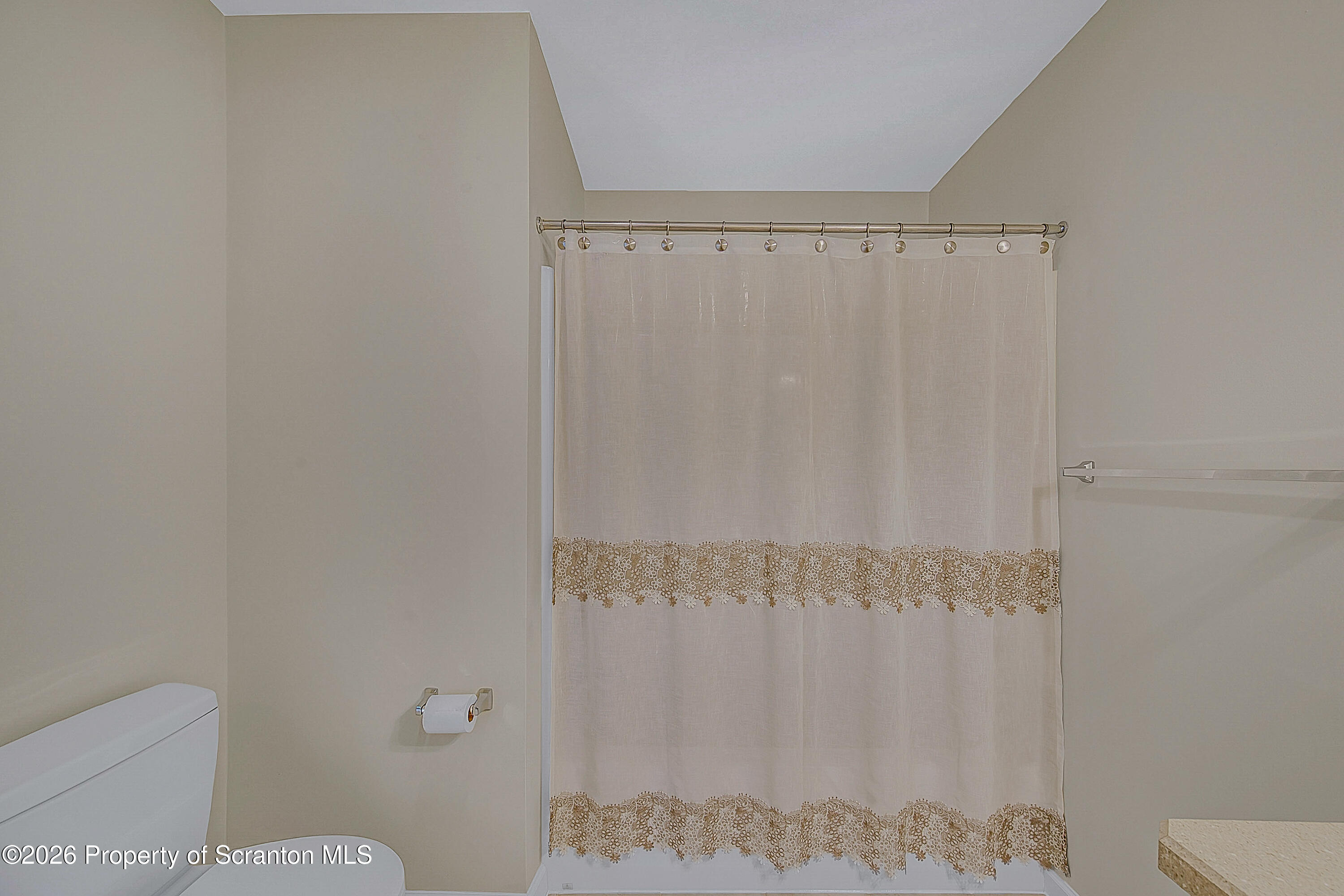 42 Wyndham Road Clarks Summit, PA 18411 - Photo 27 of 36 a bathroom with a shower curtain and a toilet