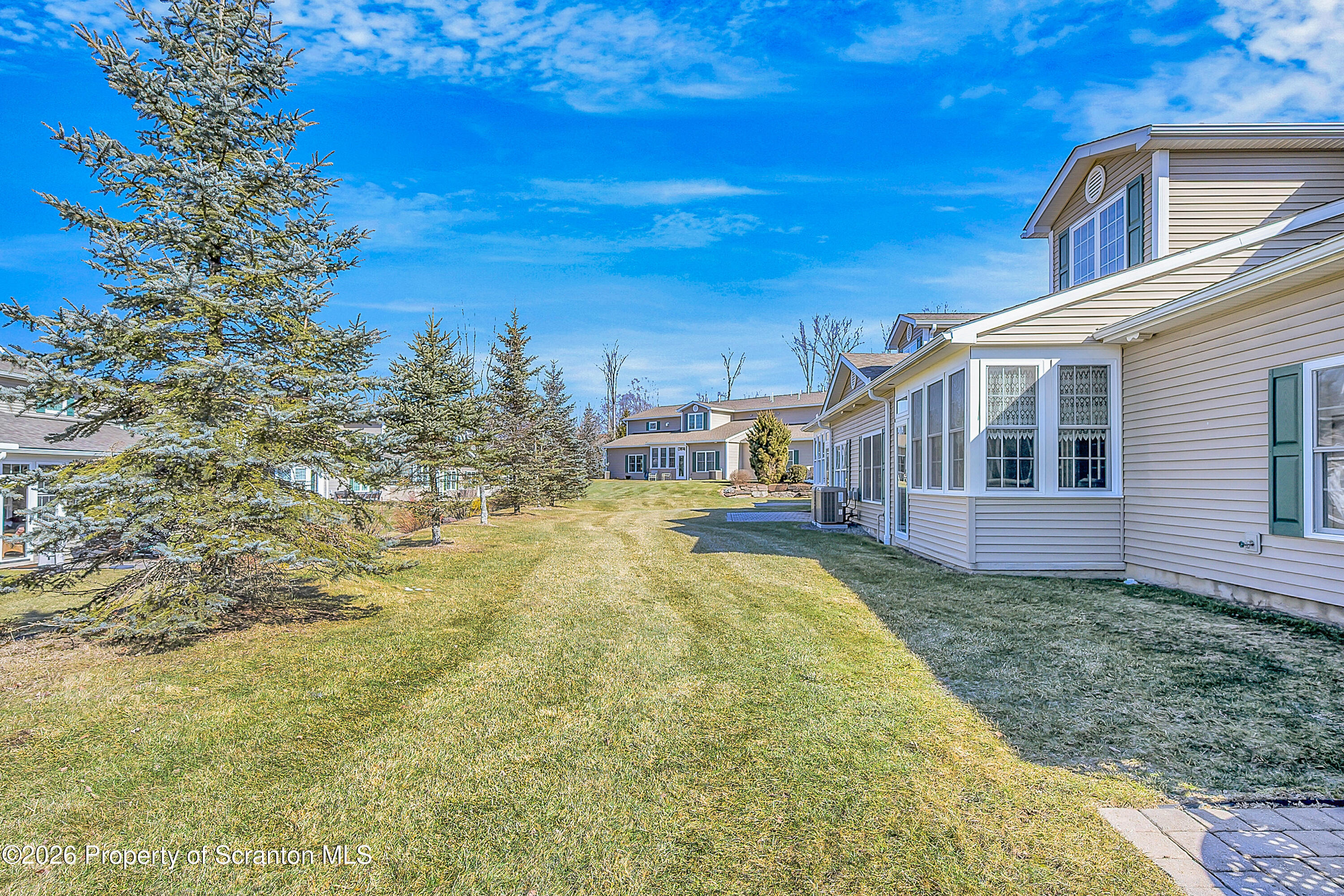 42 Wyndham Road Clarks Summit, PA 18411 - Photo 31 of 36 a view of house with yard and swimming pool