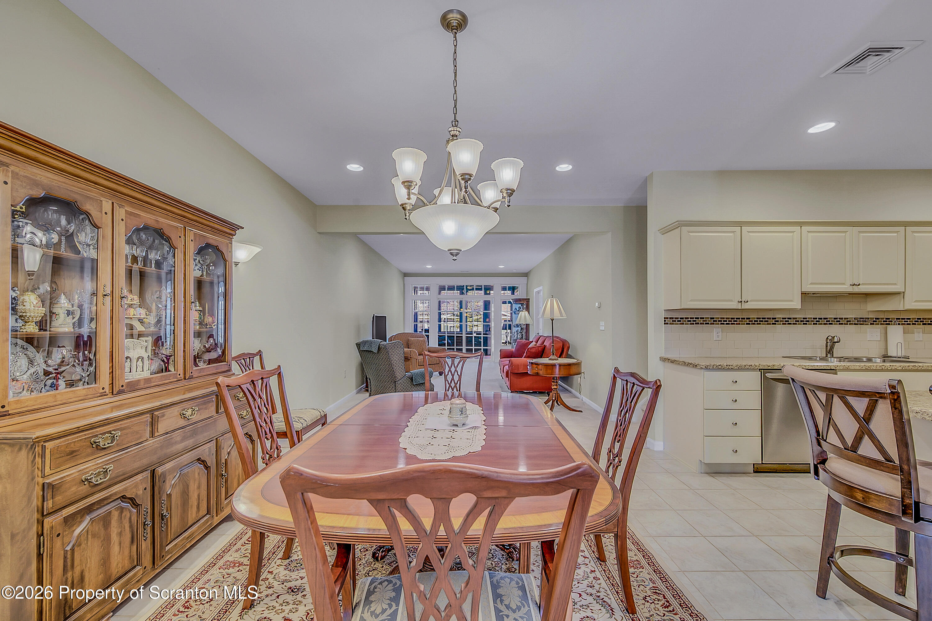 42 Wyndham Road Clarks Summit, PA 18411 - Photo 7 of 36 a view of a dining room with furniture a chandelier and wooden floor