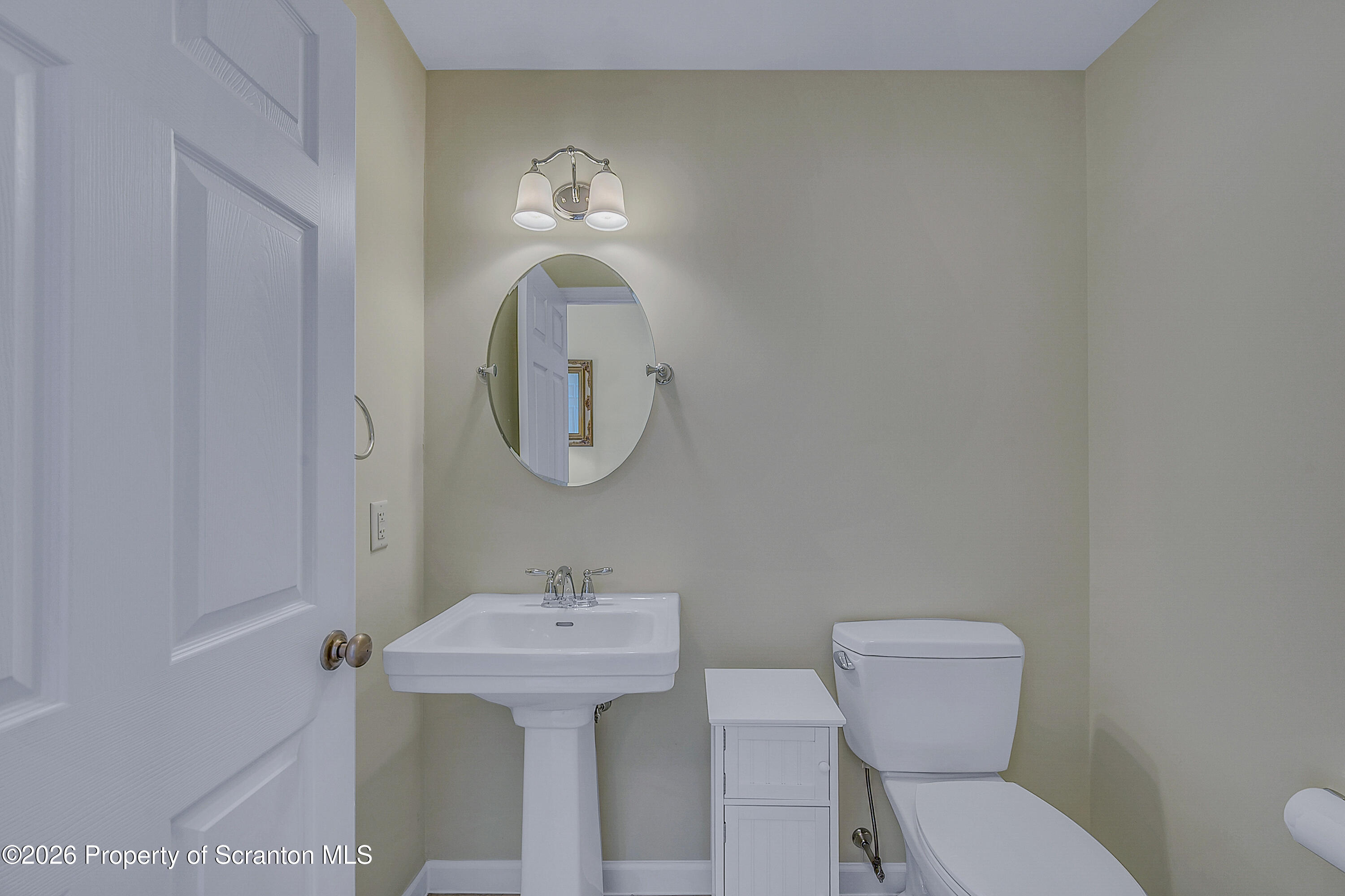 42 Wyndham Road Clarks Summit, PA 18411 - Photo 10 of 36 a bathroom with a toilet sink and mirror