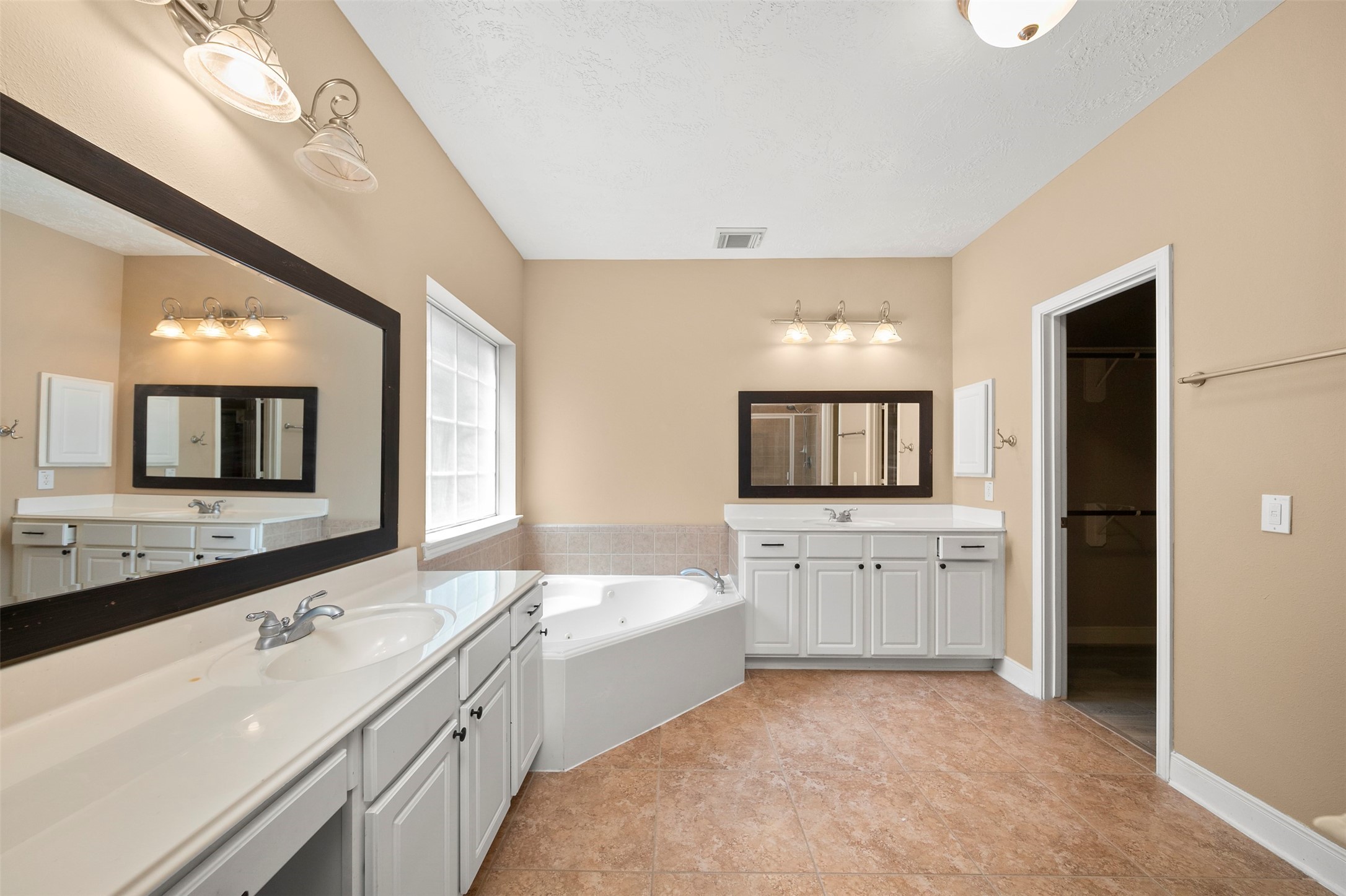 12311 Amanda Meadows Houston, TX 77089 - Photo 18 of 42 a large white kitchen with a sink and dishwasher a refrigerator with white cabinets
