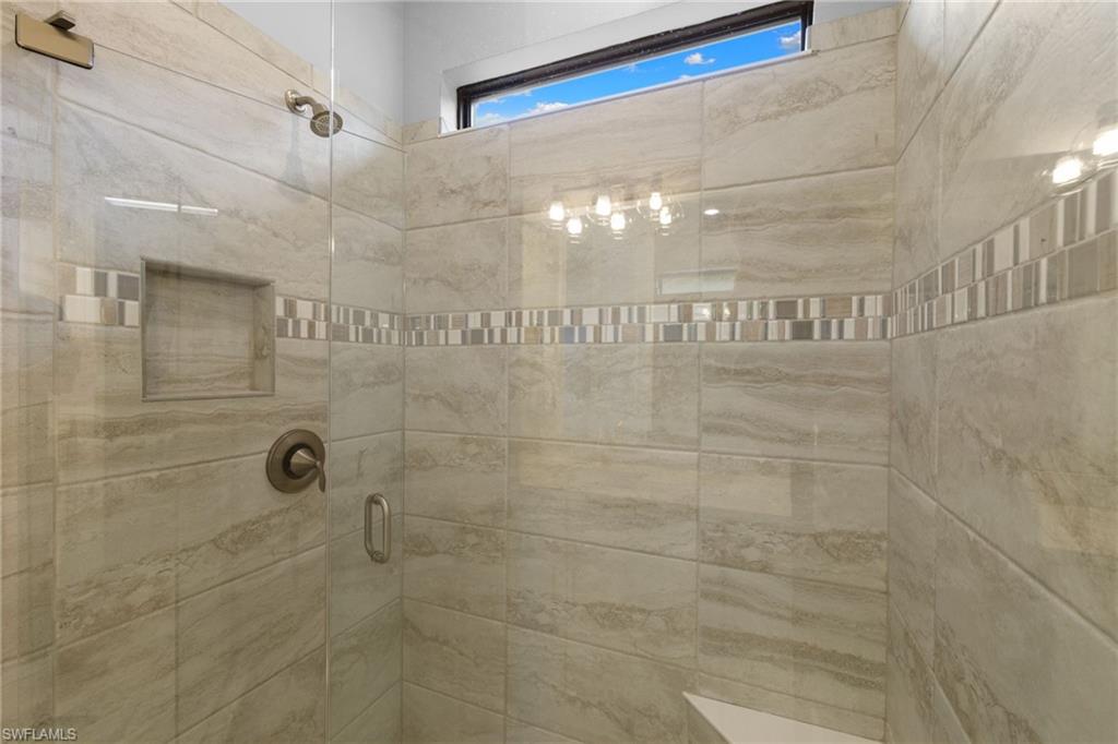 9410 Whooping Crane Way Naples, FL 34120 - Photo 20 of 38 a bathroom with a shower