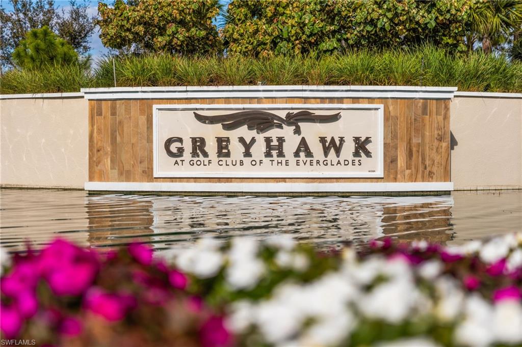 9410 Whooping Crane Way Naples, FL 34120 - Photo 2 of 38 a view of a sign on the wall
