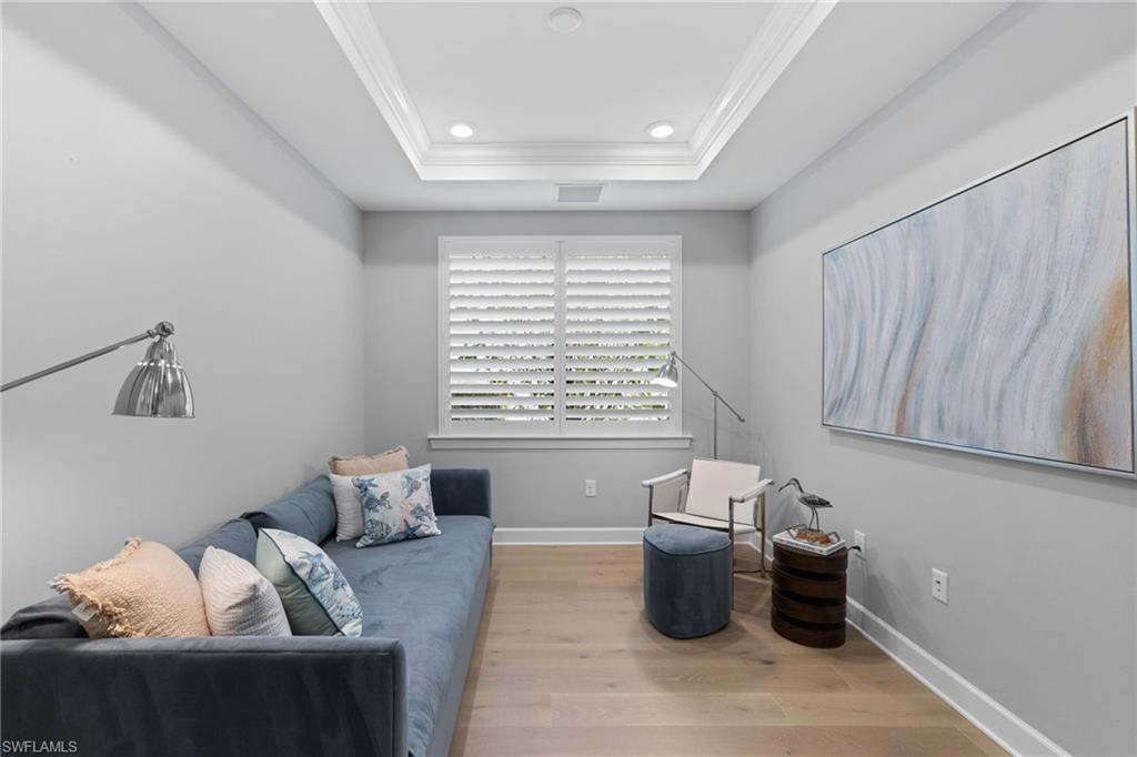 9410 Whooping Crane Way Naples, FL 34120 - Photo 24 of 38 a living room with furniture and a window