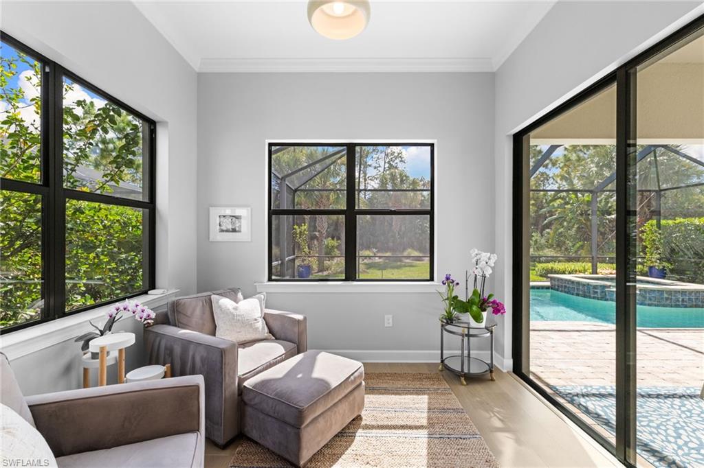 9410 Whooping Crane Way Naples, FL 34120 - Photo 26 of 38 a living room with furniture and a window