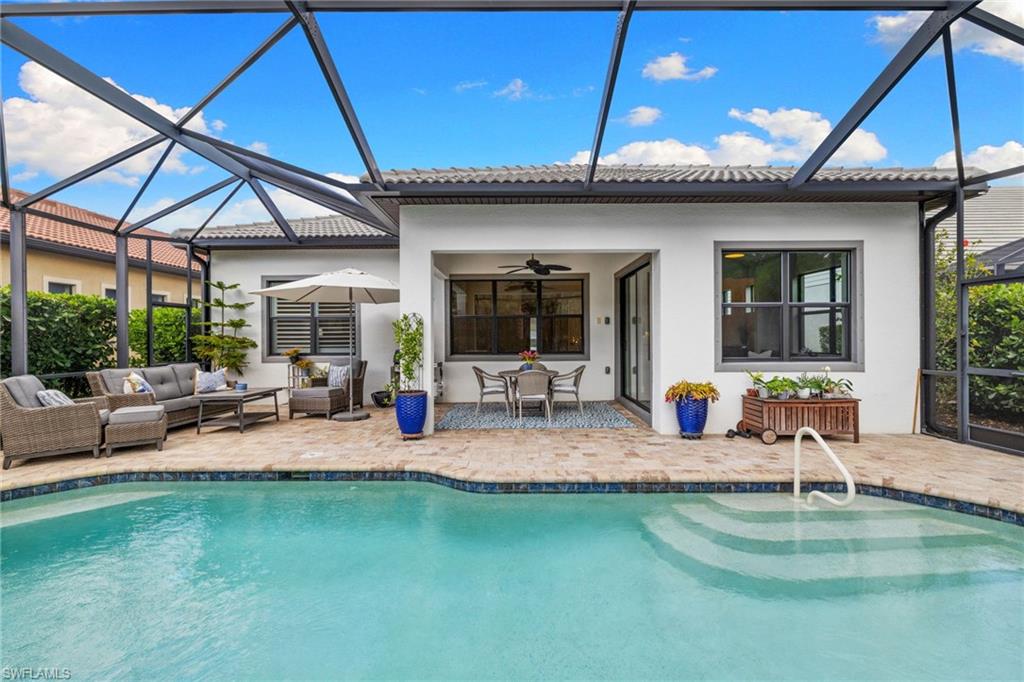 9410 Whooping Crane Way Naples, FL 34120 - Photo 29 of 38 a view of swimming pool with seating space