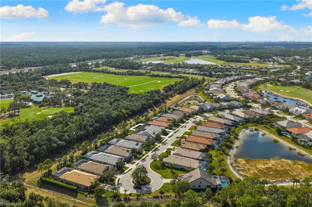 9410 Whooping Crane Way Naples, FL 34120 - Photo 34 of 38 an aerial view of residential building and ocean