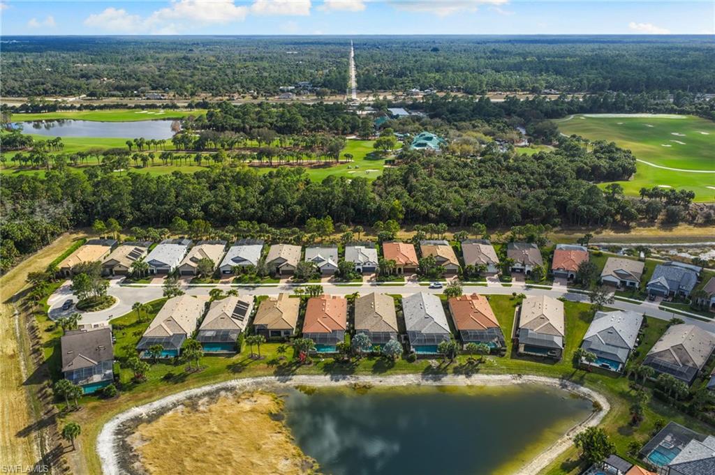 9410 Whooping Crane Way Naples, FL 34120 - Photo 36 of 38 an aerial view of residential houses with outdoor space and lake view