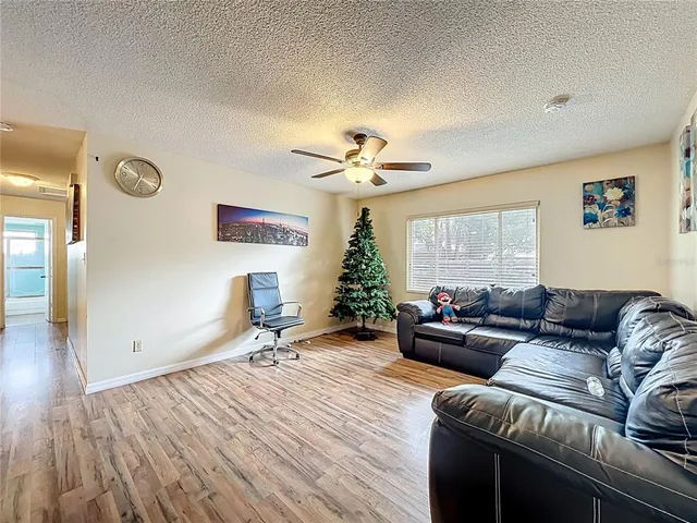 a living room with furniture and a window