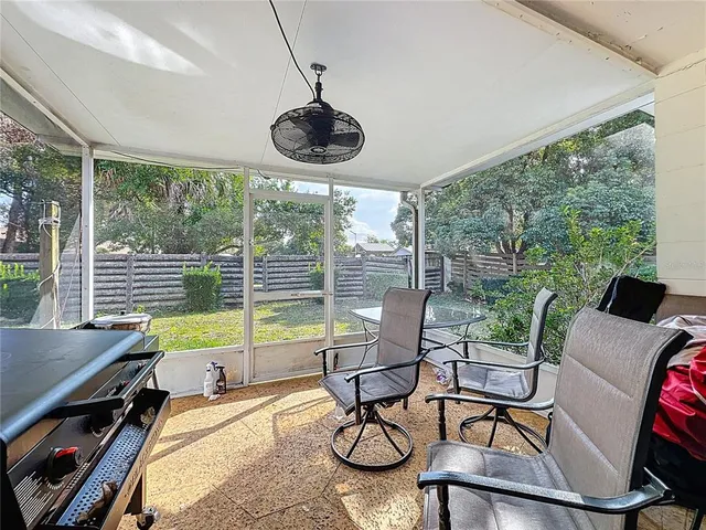 a view of a dining room with furniture wooden floor and a chandelier