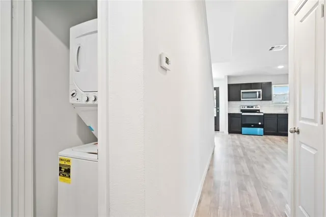 a view of a kitchen with a sink and cabinets