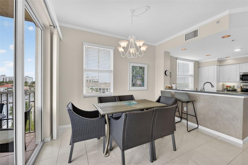 2060 Matecumbe Key Road, Unit 2506 Punta Gorda, FL 33955 - Photo 11 of 38 a view of a dining room with furniture and a chandelier