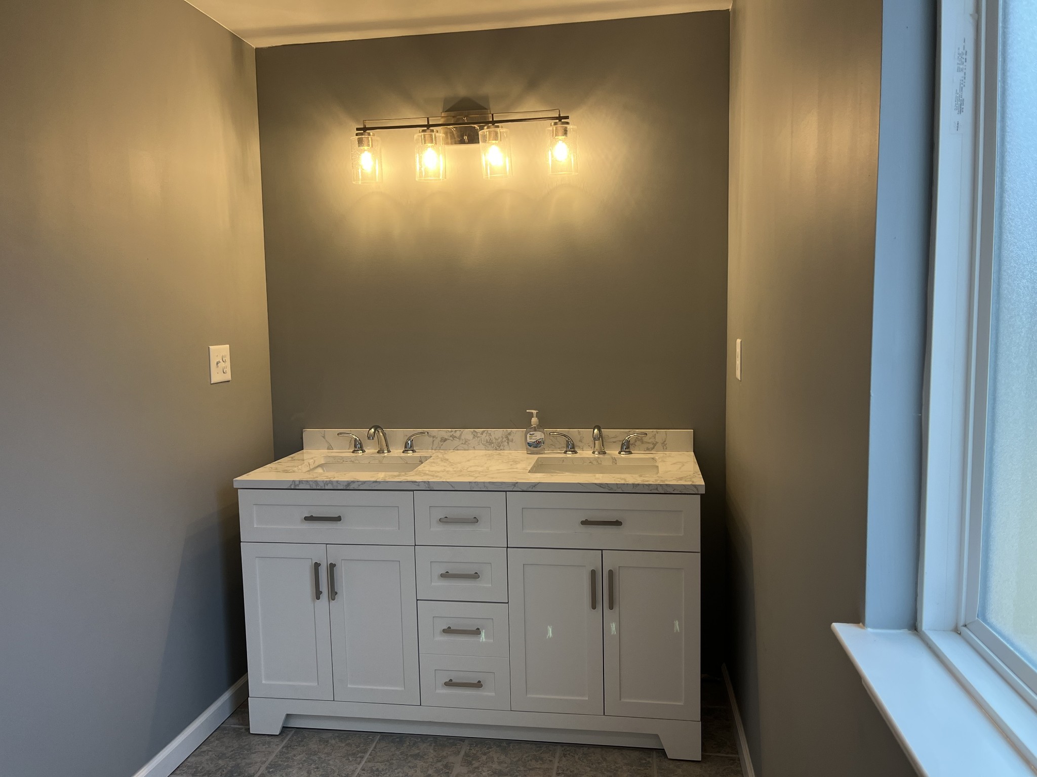 203 5th Avenue North Decherd, TN 37324 - Photo 11 of 13 a bathroom with a sink and a mirror