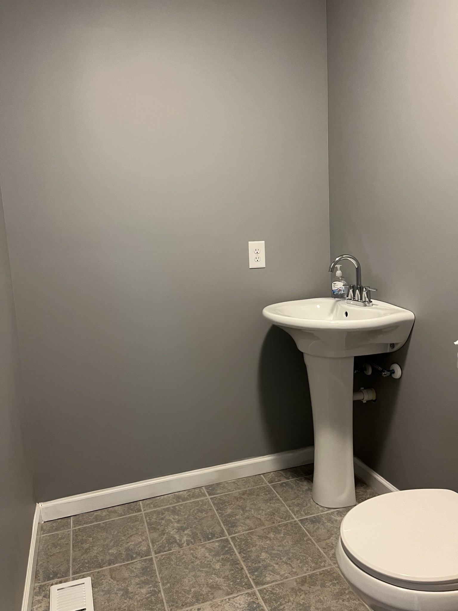 203 5th Avenue North Decherd, TN 37324 - Photo 13 of 13 a bathroom with a sink a toilet and mirror