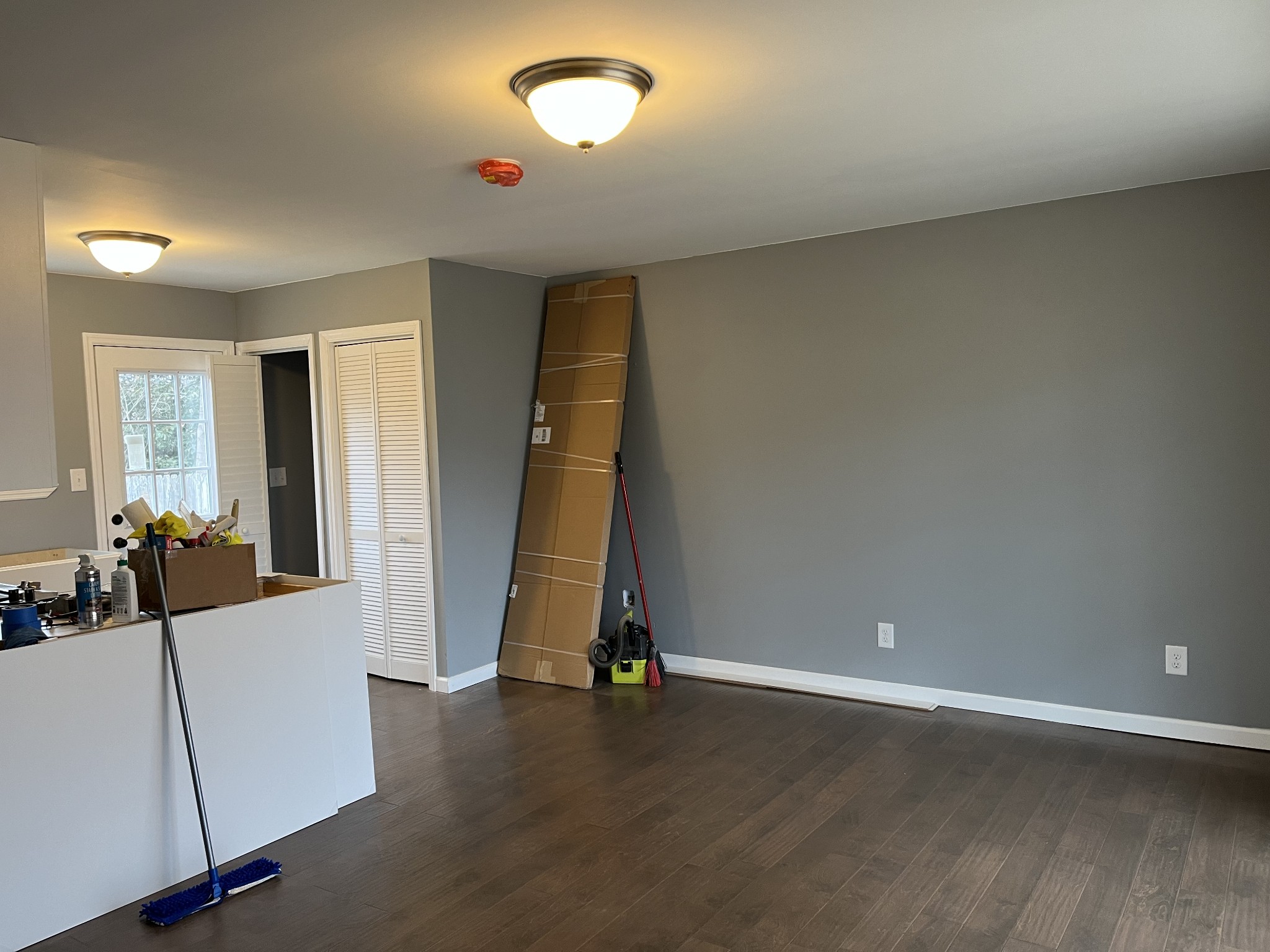 203 5th Avenue North Decherd, TN 37324 - Photo 4 of 13 an empty room with wooden floor and windows