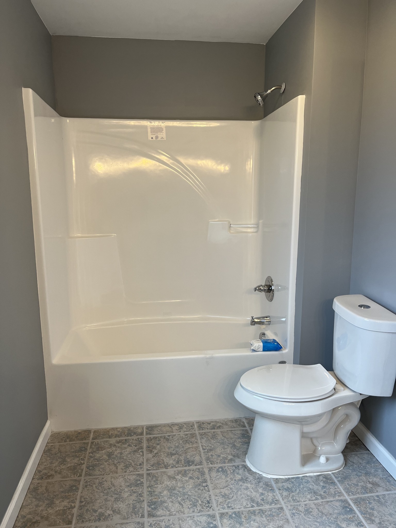 203 5th Avenue North Decherd, TN 37324 - Photo 10 of 13 a bathroom with a toilet and a shower