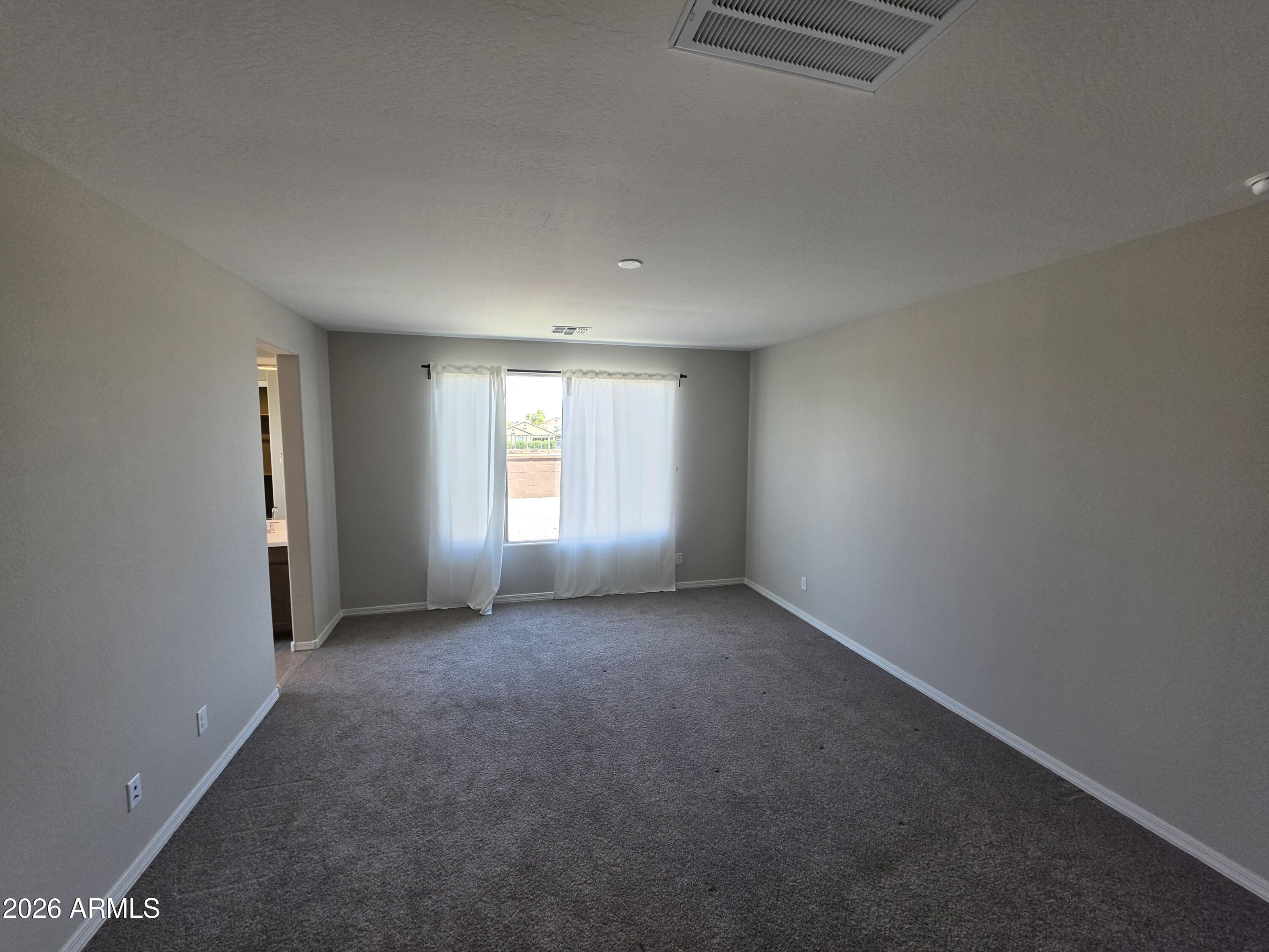 7128 West Coles Road Laveen, AZ 85339 - Photo 12 of 38 an empty room with windows
