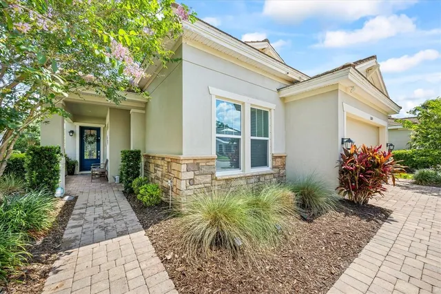 a front view of a house with garden