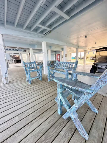 a view of a patio with a table and chairs
