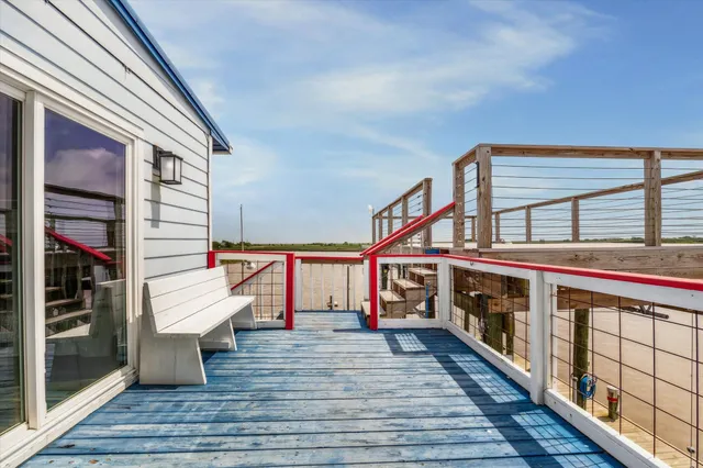 a room with wooden floor and seating space