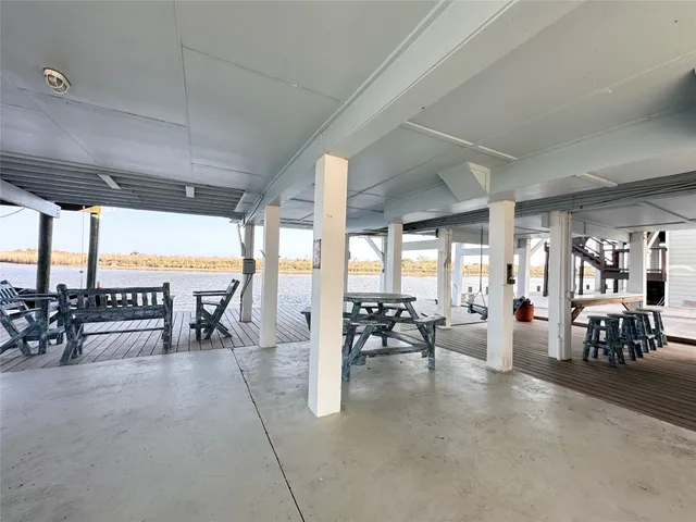 a bedroom with a bed closet and large window