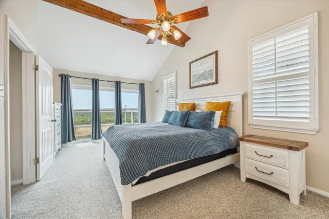 a bathroom with a granite countertop toilet sink and mirror