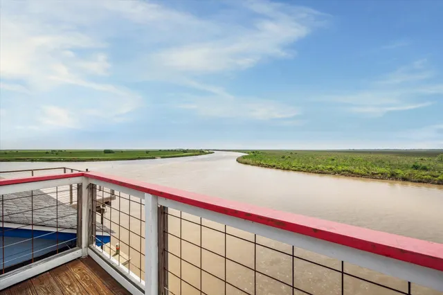 a bathroom with a sink a toilet a mirror and shower