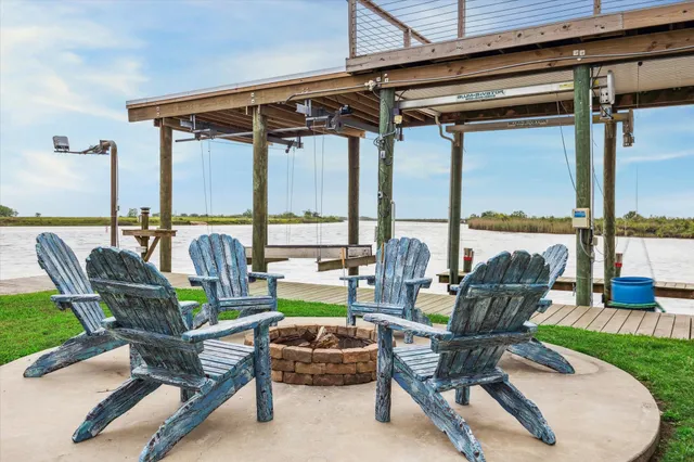 a view of a porch with wooden floor and potted plants