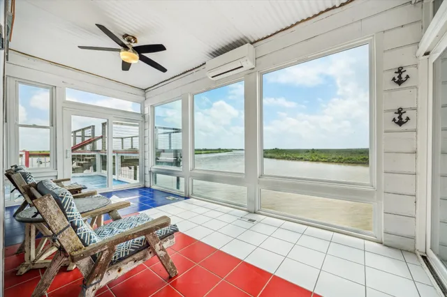 a view of a patio with table and chairs