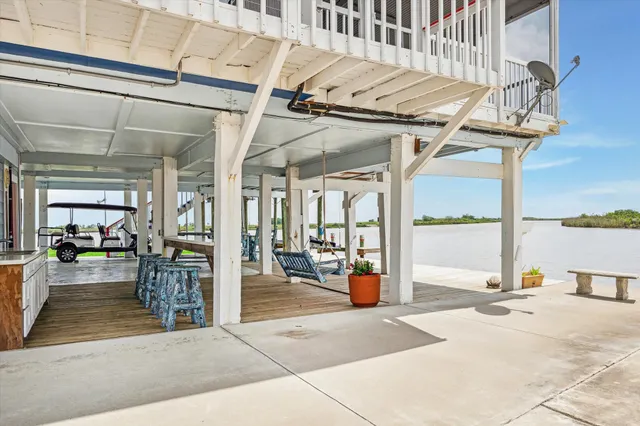 a balcony with wooden floor and stairs