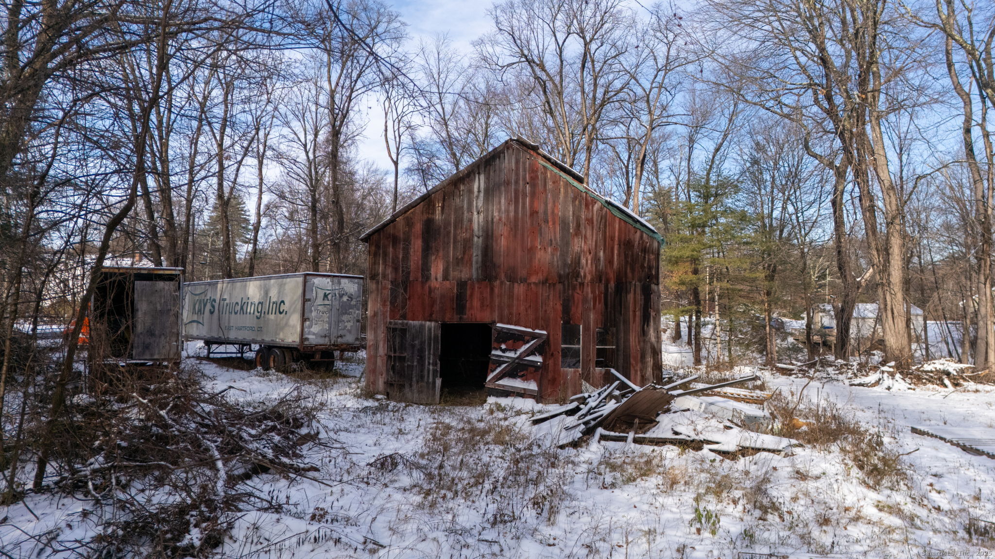 434 Tunxis Avenue Bloomfield, CT 06002 - Photo 10 of 12 a view of a barn house with a yard and covered with snow