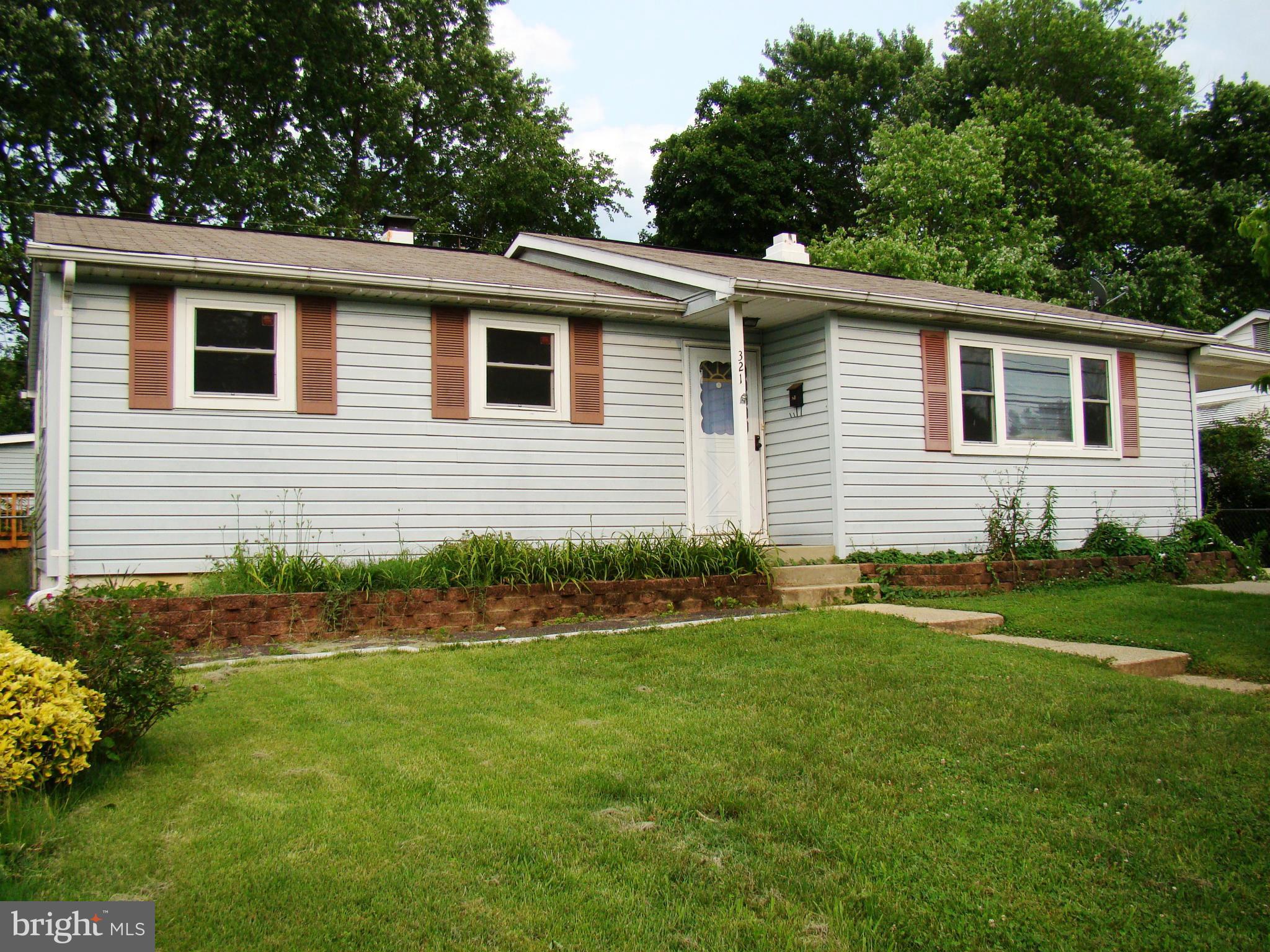 321 Brock Bridge Road Laurel, MD 20724 - Photo 1 of 20 a front view of a house with a garden