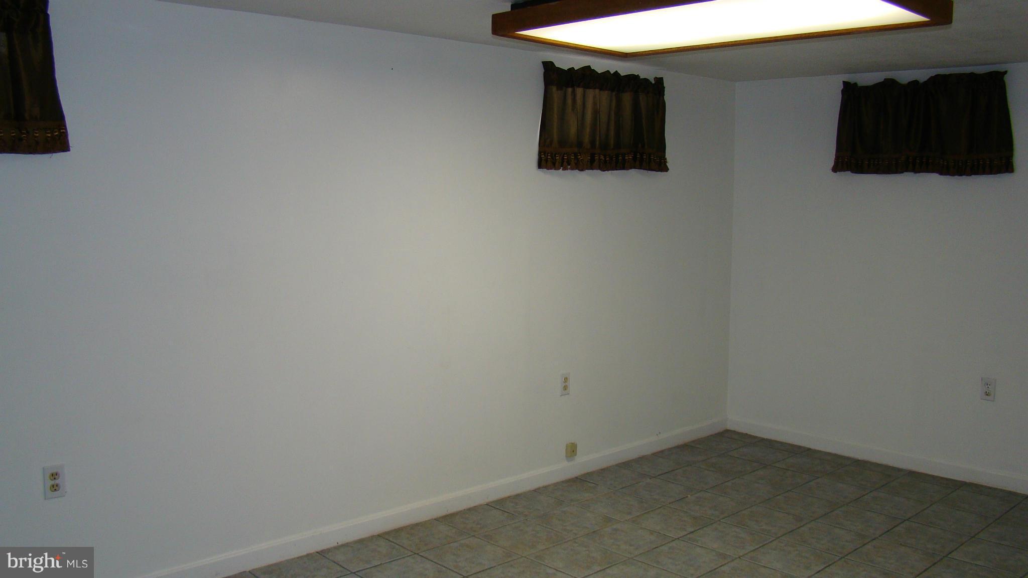 321 Brock Bridge Road Laurel, MD 20724 - Photo 13 of 20 a view of a livingroom with an empty space and a window