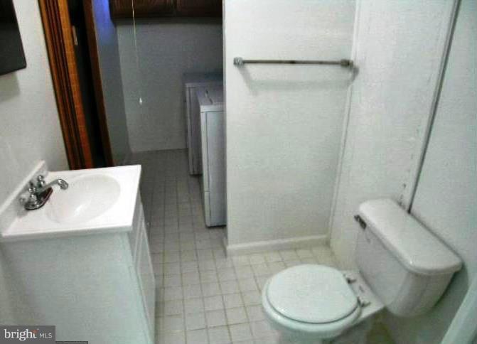 321 Brock Bridge Road Laurel, MD 20724 - Photo 16 of 20 a bathroom with a toilet a sink and a shower