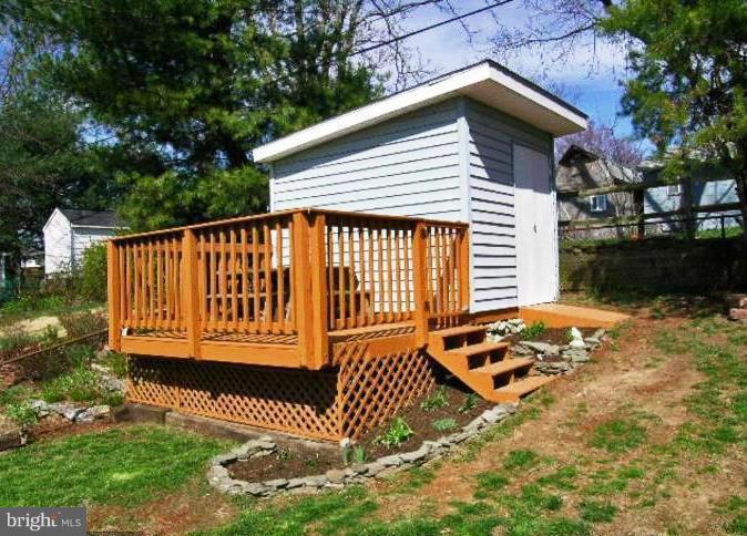 321 Brock Bridge Road Laurel, MD 20724 - Photo 20 of 20 a view of a small house with wooden fence