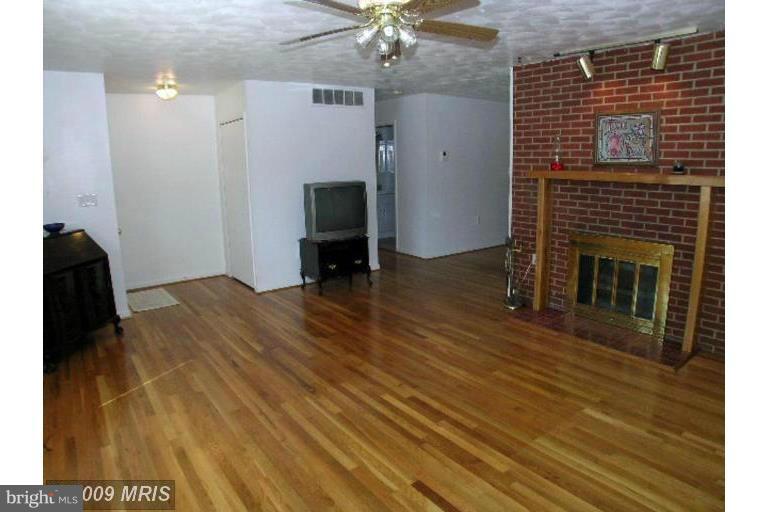 321 Brock Bridge Road Laurel, MD 20724 - Photo 3 of 20 a view of livingroom with hardwood floor and a ceiling fan