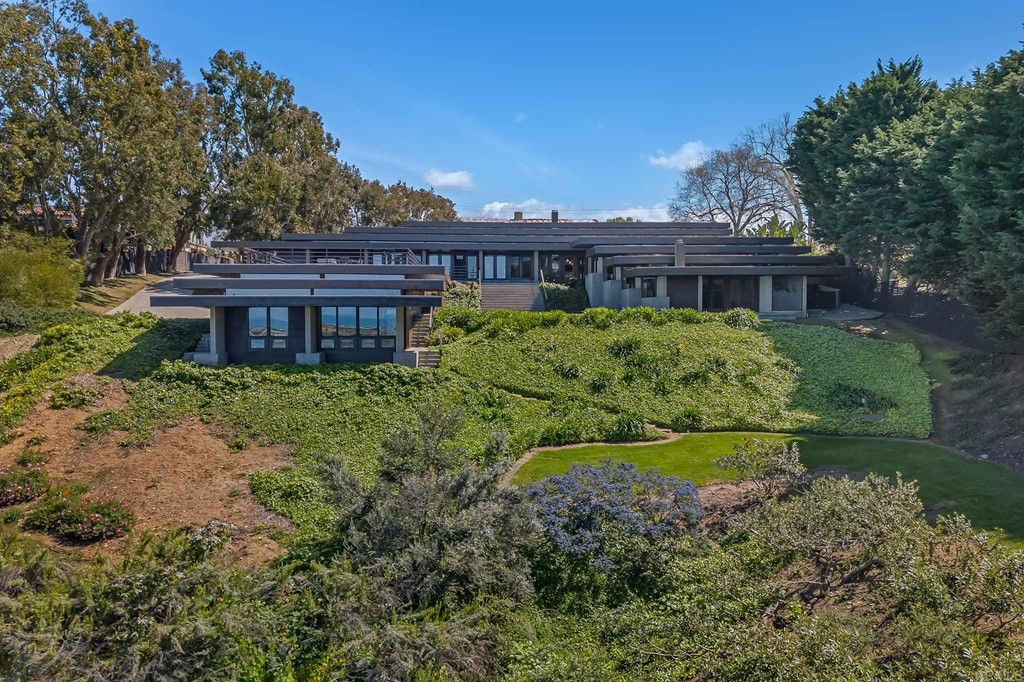 2054 Sheridan Road Encinitas, CA 92024 - Photo 2 of 58 a view of a house with a yard and potted plants