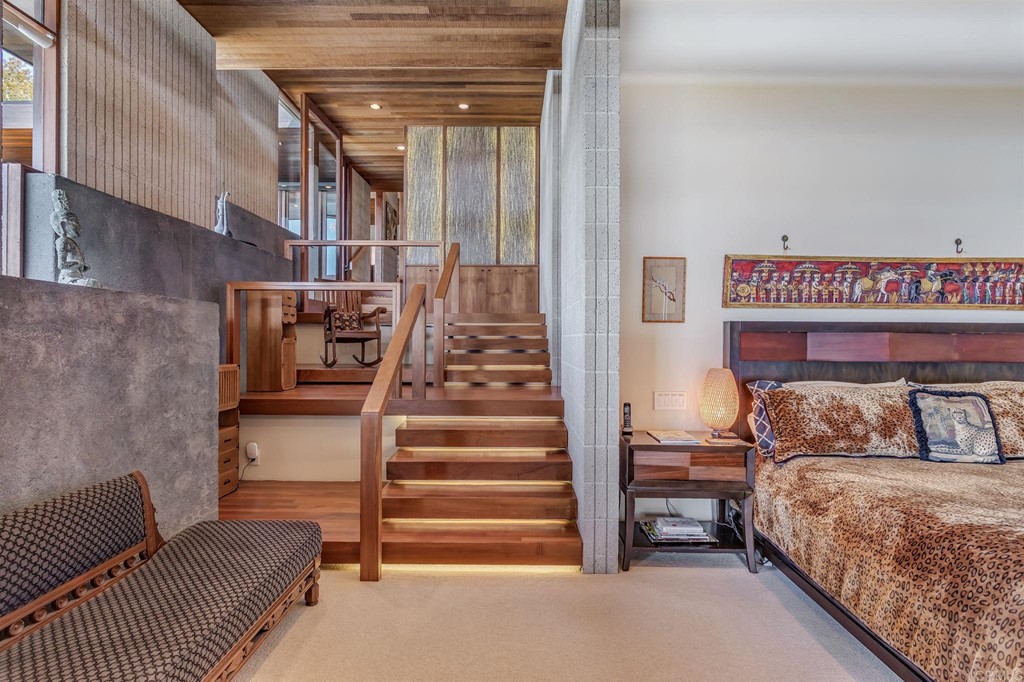 2054 Sheridan Road Encinitas, CA 92024 - Photo 30 of 58 a bedroom with furniture and a stair