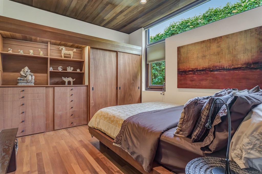 2054 Sheridan Road Encinitas, CA 92024 - Photo 35 of 58 a bedroom with a bed a window and potted plant