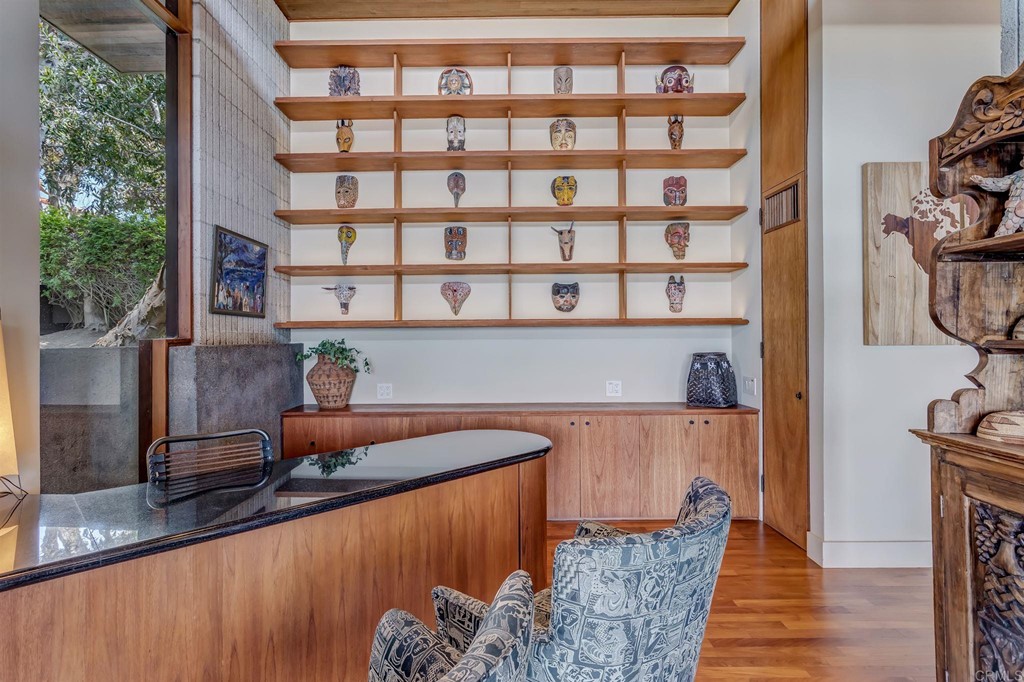 2054 Sheridan Road Encinitas, CA 92024 - Photo 42 of 58 a kitchen with stainless steel appliances granite countertop a sink and a wooden cabinets