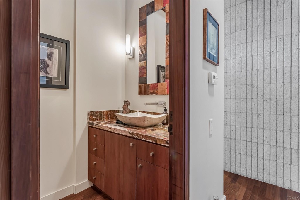 2054 Sheridan Road Encinitas, CA 92024 - Photo 43 of 58 a bathroom with a granite countertop sink and a mirror