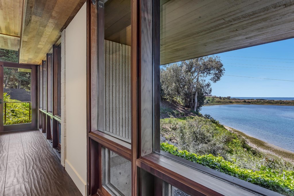2054 Sheridan Road Encinitas, CA 92024 - Photo 56 of 58 a view of a balcony with wooden floor and fence