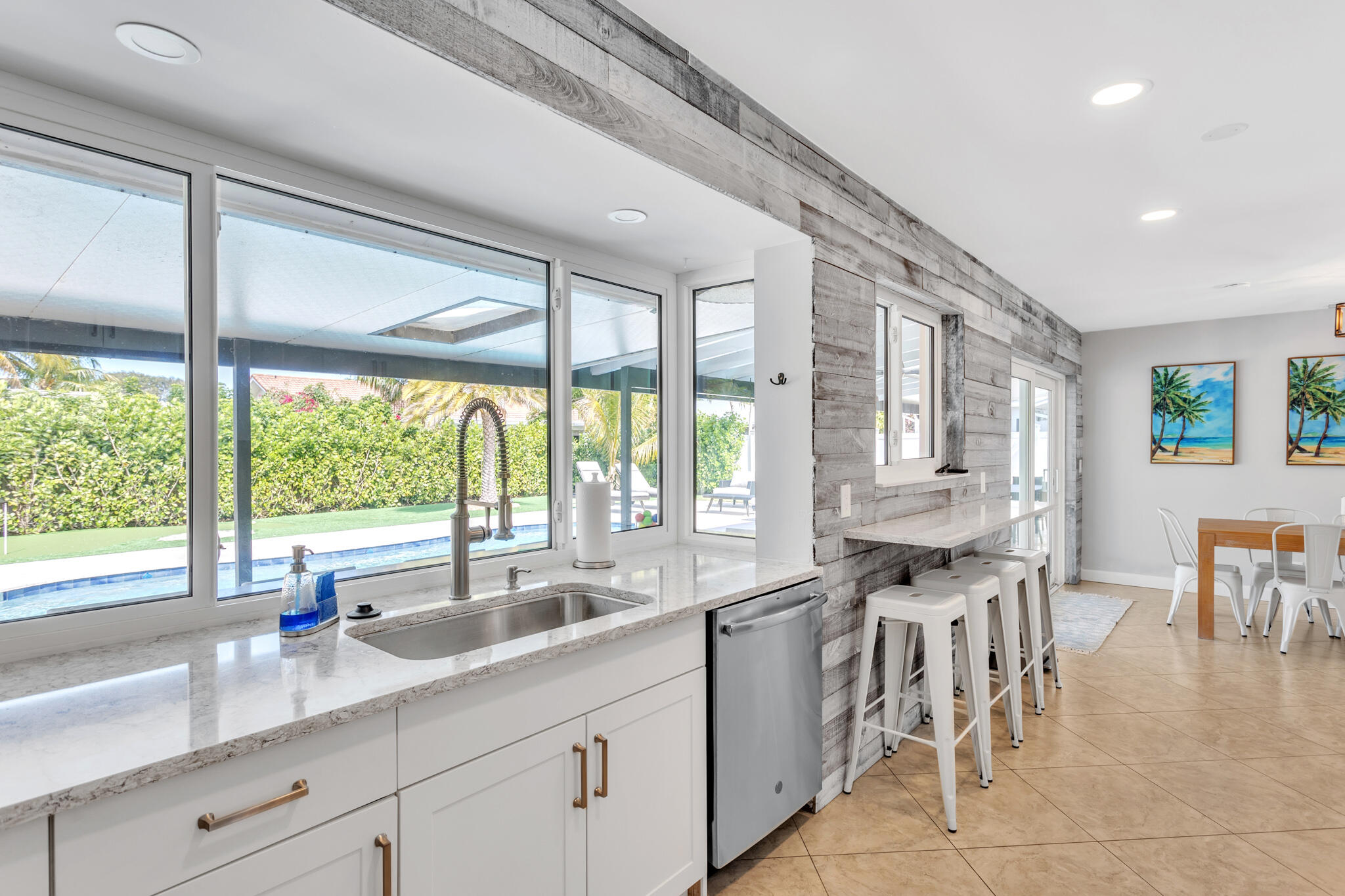 19 Willow Road Tequesta, FL 33469 - Photo 14 of 31 a kitchen with a sink and large window