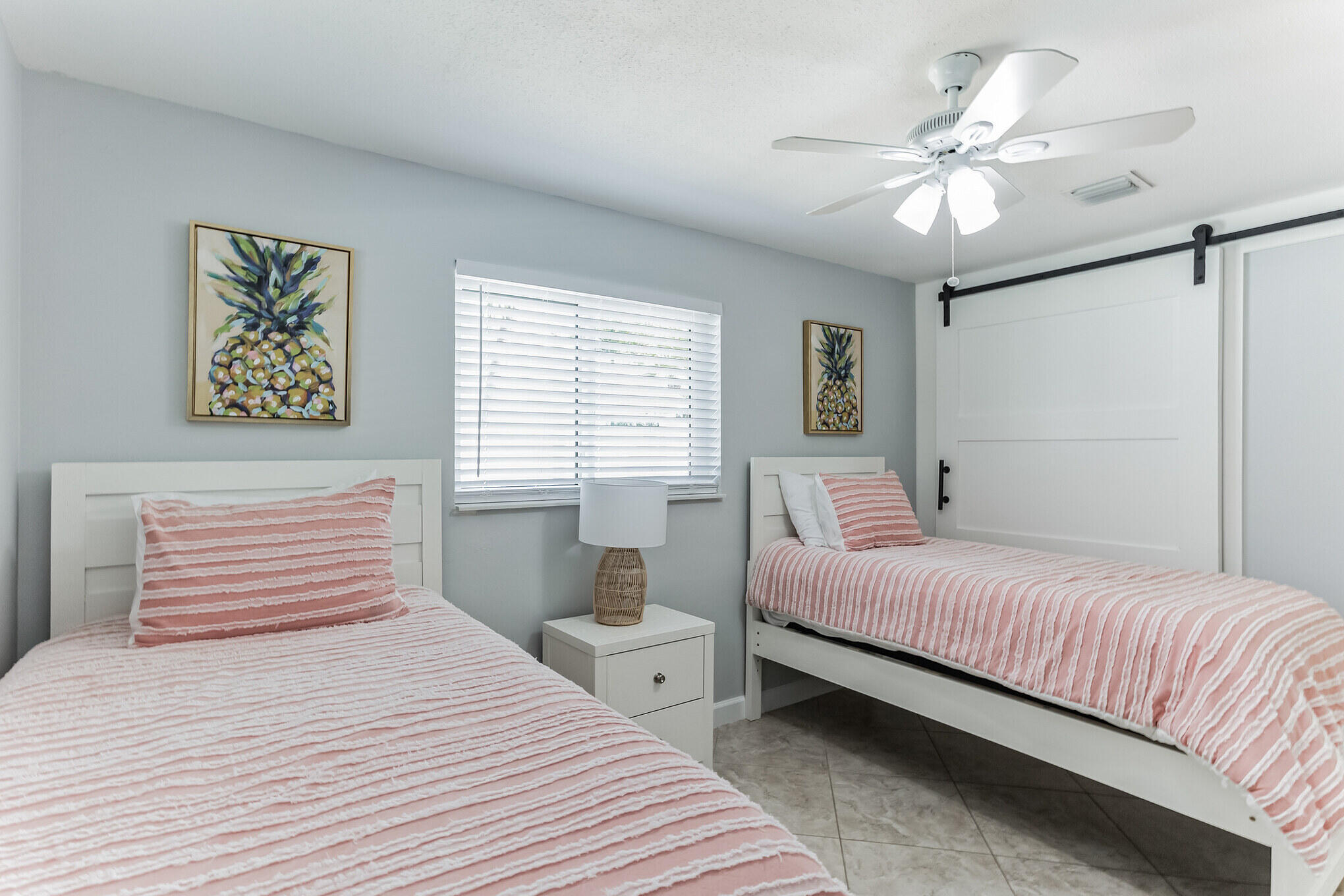 19 Willow Road Tequesta, FL 33469 - Photo 26 of 31 a bedroom with a large bed and a chandelier