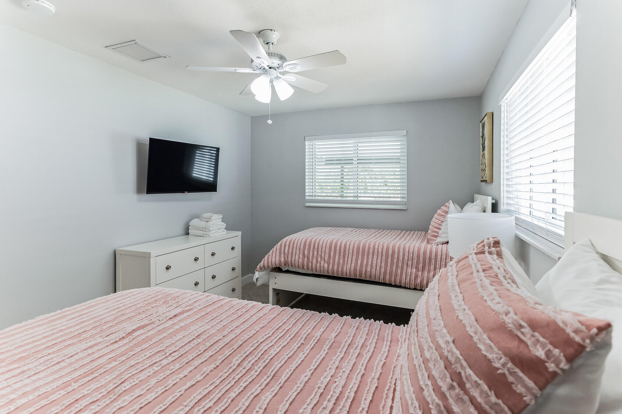19 Willow Road Tequesta, FL 33469 - Photo 27 of 31 a bedroom with a bed and a flat screen tv
