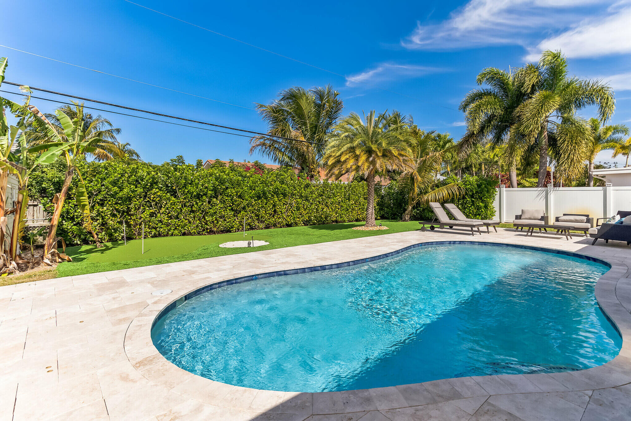 19 Willow Road Tequesta, FL 33469 - Photo 3 of 31 a view of a swimming pool with a yard