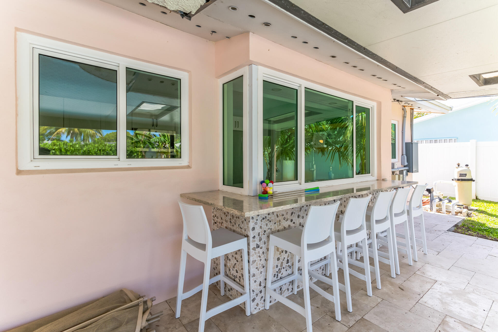 19 Willow Road Tequesta, FL 33469 - Photo 5 of 31 a view of a dining room with furniture window and outside view