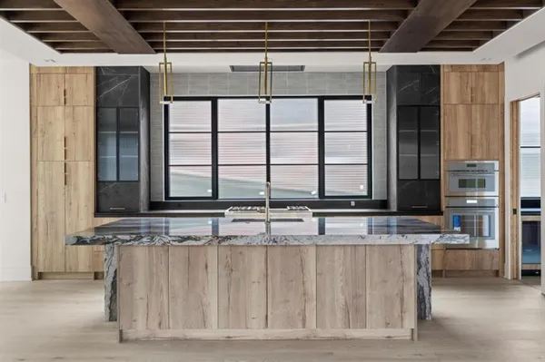 a kitchen with a sink and a refrigerator